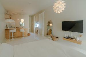 Et tv og/eller underholdning på 제주 무이펜션