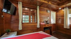 En eller flere senge i et værelse på OYO 604 Ruen Mai Horm Resort + 112 billeder