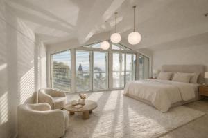 a bedroom with a bed and a table and chairs at Pop villa in La Celle-sous-Gouzon