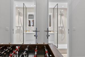 a bathroom with a bunch of glass shower stalls at Maison Lombard by Reside in Brussels +150 photos