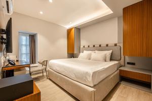En eller flere senge i et værelse på Get Royal Hotel & Spa + 118 billeder