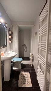 a bathroom with a sink and a toilet at Garden house in Arta +22 photos