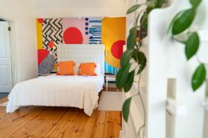 En eller flere senge i et værelse på Mediterranean Villa Guesthouse