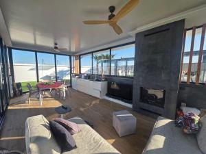 a living room with a couch and a fireplace at ZEN Villa in Rrushkull