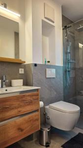 Et badeværelse på Alpen Sky Apartments + 26 billeder