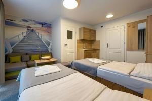 Ένα ή περισσότερα κρεβάτια σε δωμάτιο στο Dom Gościnny Matex +30 φωτογραφίες