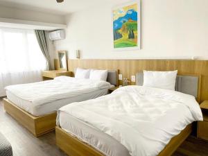 Postel nebo postele na pokoji v ubytování Star Hotel - Khách sạn Ngôi Sao