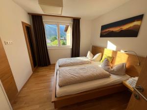 Postel nebo postele na pokoji v ubytování Venediger-Chalet