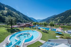 an aerial view of a resort with a swimming pool at smartHOTEL in Dorfgastein