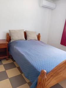 Giường trong phòng chung tại Le Refuge