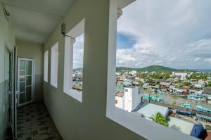 a balcony with a view of a city at Kim Hồng Anh Guest House in Phu Quoc