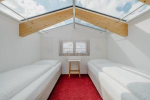 En eller flere senge i et værelse på LAMA Appartement