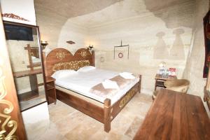 En eller flere senge i et værelse på Peri Cave Hotel