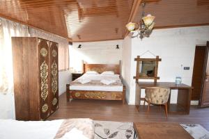 En eller flere senge i et værelse på Peri Cave Hotel + 78 billeder