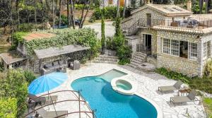an aerial view of a house with a swimming pool at Charming villa - perfectly located in Roquefort-les-Pins