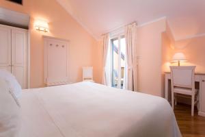 Кровать или кровати в номере Hotel Cenobio Dei Dogi