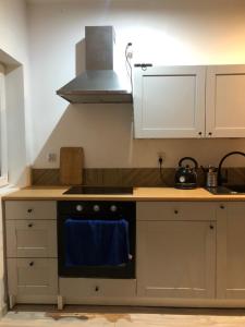 Kuchyň nebo kuchyňský kout v ubytování Apartament Cozy Studio + 3 fotografie