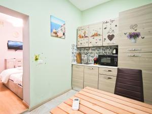 Kuchyň nebo kuchyňský kout v ubytování Dal Monsingore