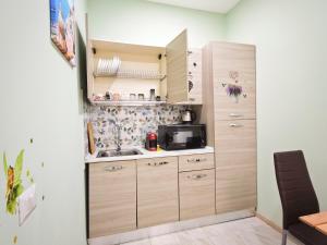 Kuchyň nebo kuchyňský kout v ubytování Dal Monsingore + 64 fotografií