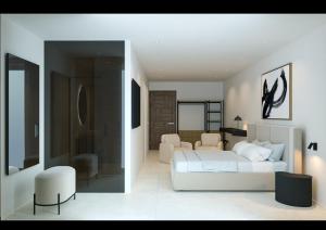 een witte slaapkamer met een bed en een woonkamer bij Fenici Levanzo Hotel - Adults Only in Levanzo +8 foto's