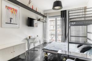 a bedroom with a bunk bed and a desk at Restored, immaculate condo @ historic center #1 in Thessaloniki