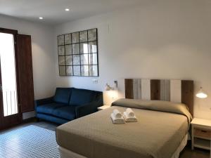 En eller flere senge i et værelse på COSTERA TERRAZA - HappyVila