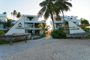 a resort with two interpretive signs in front of a building at Changarawe Hotel & Retreat in Pongwe