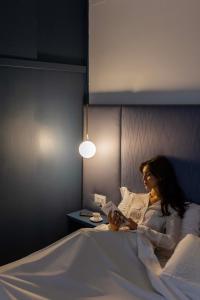 Postel nebo postele na pokoji v ubytování Boutique Hotel Maria Vittoria