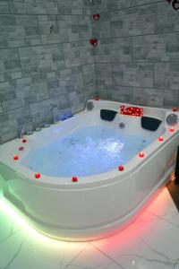 a large bath tub with red lights in a bathroom at B&B A Da Ziett Suite in Naples +33 photos
