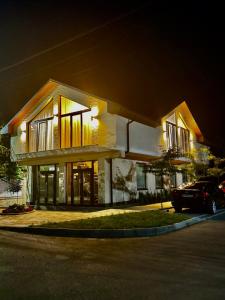 a house with a car parked in front of it at night at Yu-home 2 in Mukacheve