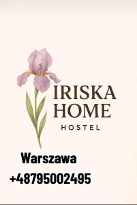 een bord voor een huis met een bloem erop bij Iriska Home in Warschau