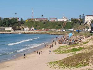 a group of people on a beach near the water at Villa Alicia Vavindrano in Fort Dauphin +58 photos