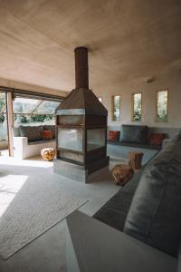 Ένα ή περισσότερα κρεβάτια σε δωμάτιο στο Elements Lodges