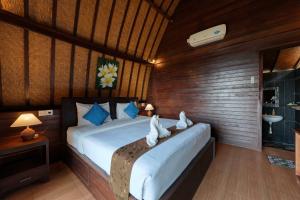 Postel nebo postele na pokoji v ubytování Bataran Garden Cottage