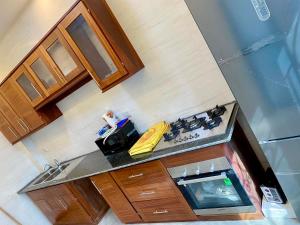 an overhead view of a kitchen with a stove at Résidence Prestige KGV Appt 201 in Douala +27 photos