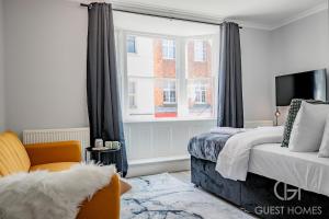 En eller flere senge i et værelse på Guest Stays - Bridge Street Studio 3
