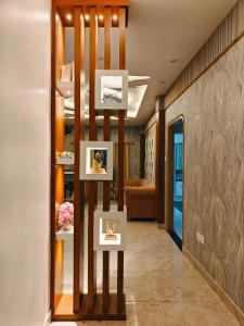 a hallway with photographs on display in a building at Hotel The Pushpraj in Varanasi