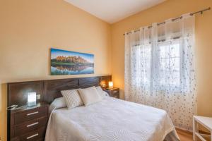 En eller flere senge i et værelse på Casa Los Duraznos