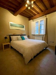 Postel nebo postele na pokoji v ubytování Superhost Lucca Casa Galli 77 Two Bedrooms Two Bathrooms