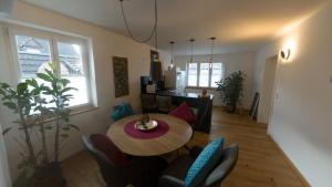 a living room with a table and chairs at Erftstege#4 in Bad Münstereifel