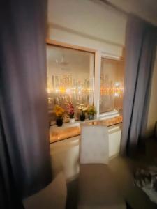 a view of a city skyline from a window at Sryia 1 in Sharjah