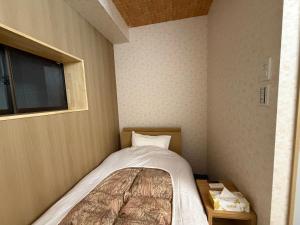 Ένα ή περισσότερα κρεβάτια σε δωμάτιο στο 湯沢粉雪の宿