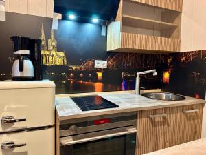 a kitchen with a sink and a counter top at Optimus Mechernich in Mechernich