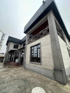 a building with a large window on the side of it at Friends in Osh