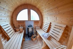 an overhead view of a wooden cabin with benches at Host Monti del Sole in Meano