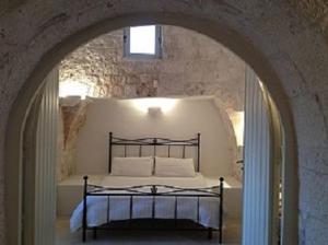 Een bed of bedden in een kamer bij Trullo Annina