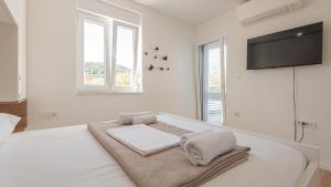 En eller flere senge i et værelse på Holiday home Iva by Villas Guide + 28 billeder