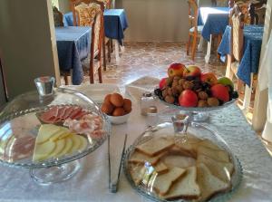 a table with two plates of food on it at Il Borgo del Castello in Rota d'Imagna