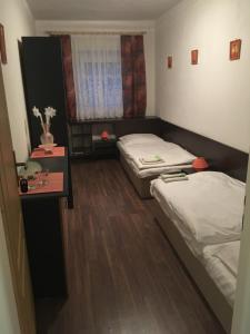 Postel nebo postele na pokoji v ubytování HARRYS City Motel