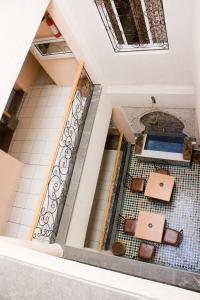 a view from the top of a building with a tile floor at Hotel Bab Boujloud in Fez